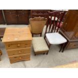 A MODERN PINE BEDROOM CHEST, UPHOLSTERED STOOL/WORKBOX ON BLACK LEGS AND STAG STYLE DINING CHAIR