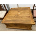 A MODERN J S GLOBAL LOW TABLE WITH SLIDING TOP TO REVEAL STORAGE 35" SQUARE