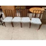 A SET FOUR EDWARDIAN MAHOGANY AND INLAID SHERATON REVIVAL DINING CHAIRS ON TAPERING LEGS