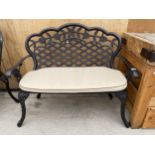 A CAST ALLOY TWO SEATER GARDEN BENCH WITH CUSHION (L:107CM)