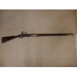 A FLINTLOCK MUSKET, 98CM BARREL, WOODEN STOCK WITH BRASS MOUNTS, LENGTH 141CM