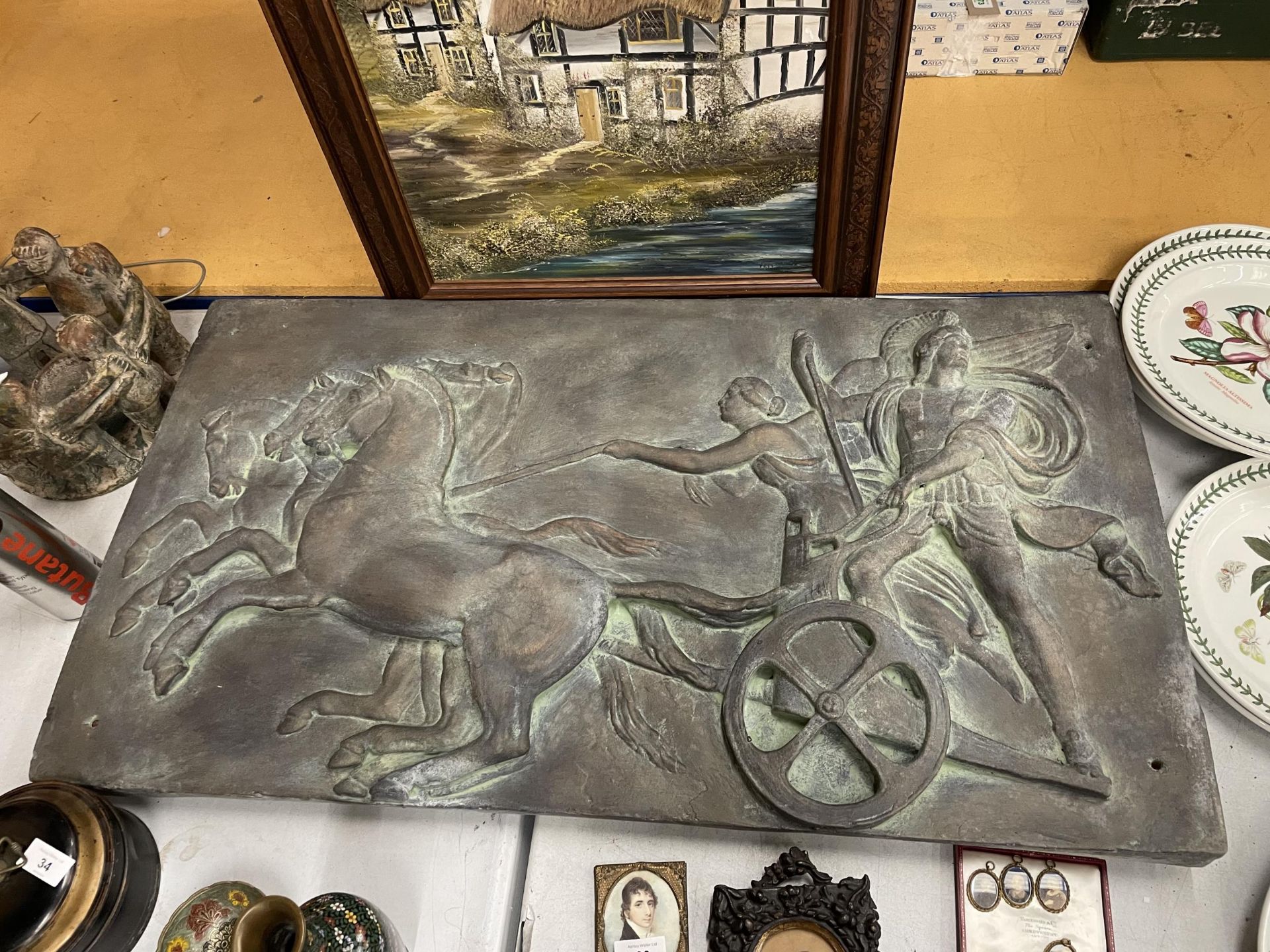 A LARGE RECONSITIUTED STONE PLAQUE OF A ROMAN CHARIOT 93CM X 51CM