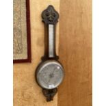 A VINTAGE WOODEN CASED ANEROID BAROMETER