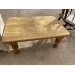 A MODERN PINE COFFEE TABLE ON TURNED LEGS, 36X24"