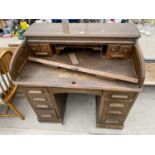 AN EARLY 20TH CENTURY OAK ROLL-TOP DESK ENCLOSING NINE DRAWERS, 40" WIDE