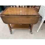 A MID 20TH CENTURY OAK TWO TIER TROLLEY