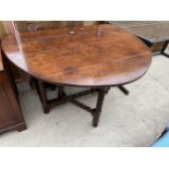 A GEORGIAN STYLE OAK GATE LEG TABLE DINING TABLE ON BOBBIN TURNED LEGS AND STRETCHERS 59" X 48"