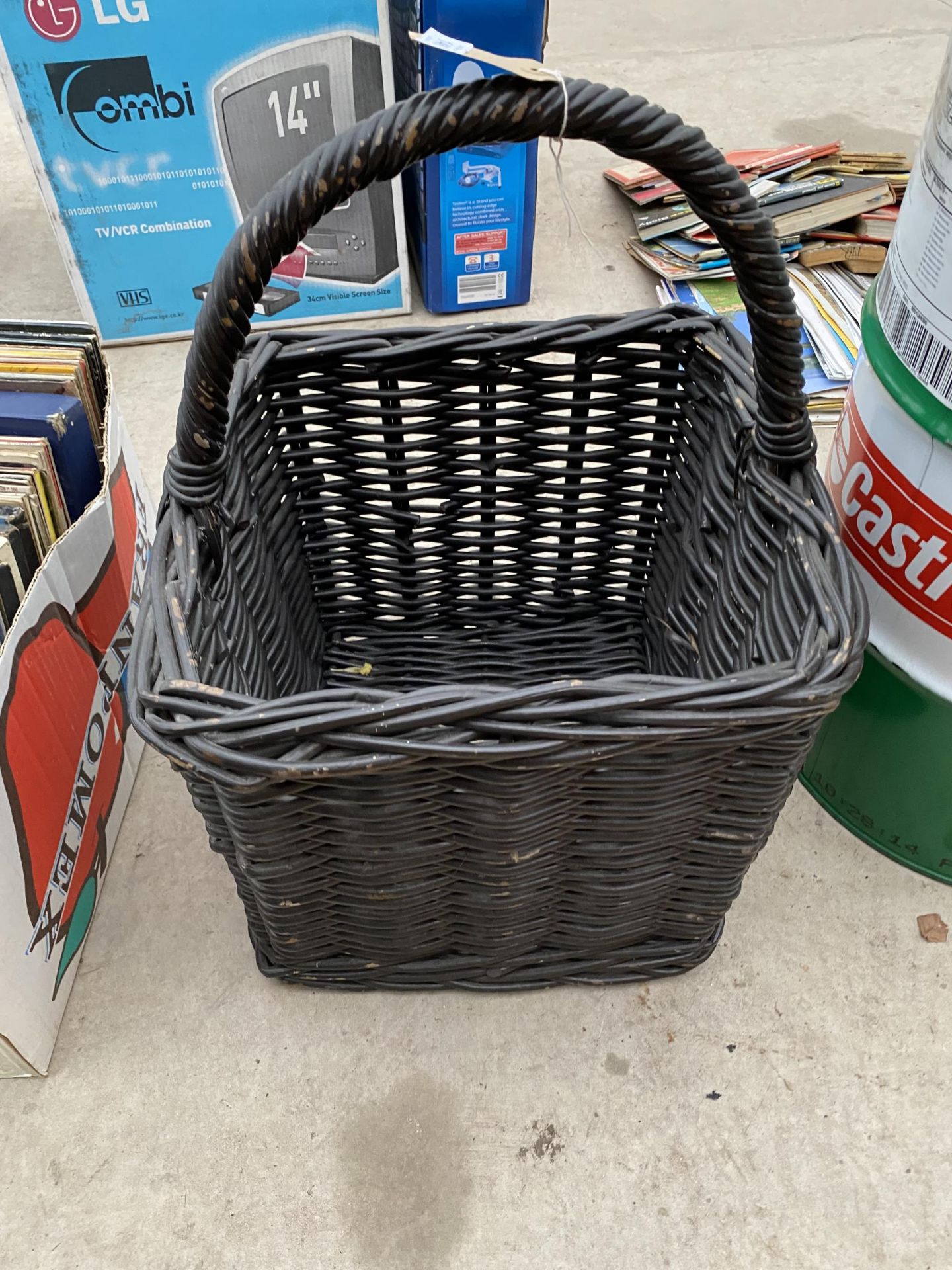 A SQUARE WICKER LOG BASKET