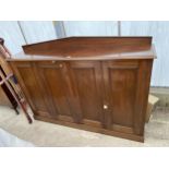 A 19TH CENTURY MAHOGANY PANELLED FOUR DOOR CABINET WITH RAISED BACK, 70.5" WIDE