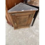 A GEORGE III OAK CORNER CUPBOARD WITH FOUR BRASS HINGES