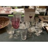 A COLLECTION OF GLASSWARE AND GLASSES TO INCLUDE A CAKE STAND, VASES, JUGS, ETC PLUS BOXED WINE