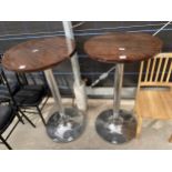 A PAIR OF 23.5" TALL PUB TABLES ON POLISHED CHROME BASES