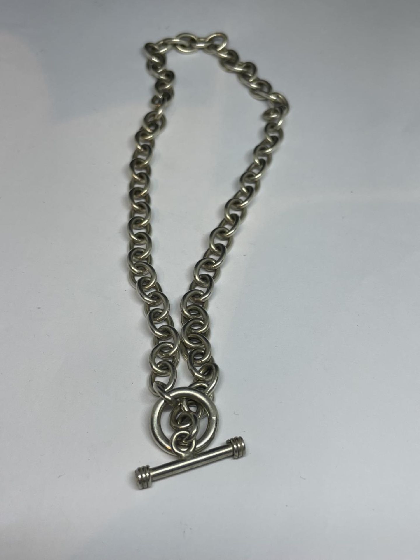 A MARKED SILVER T BAR NECKLACE