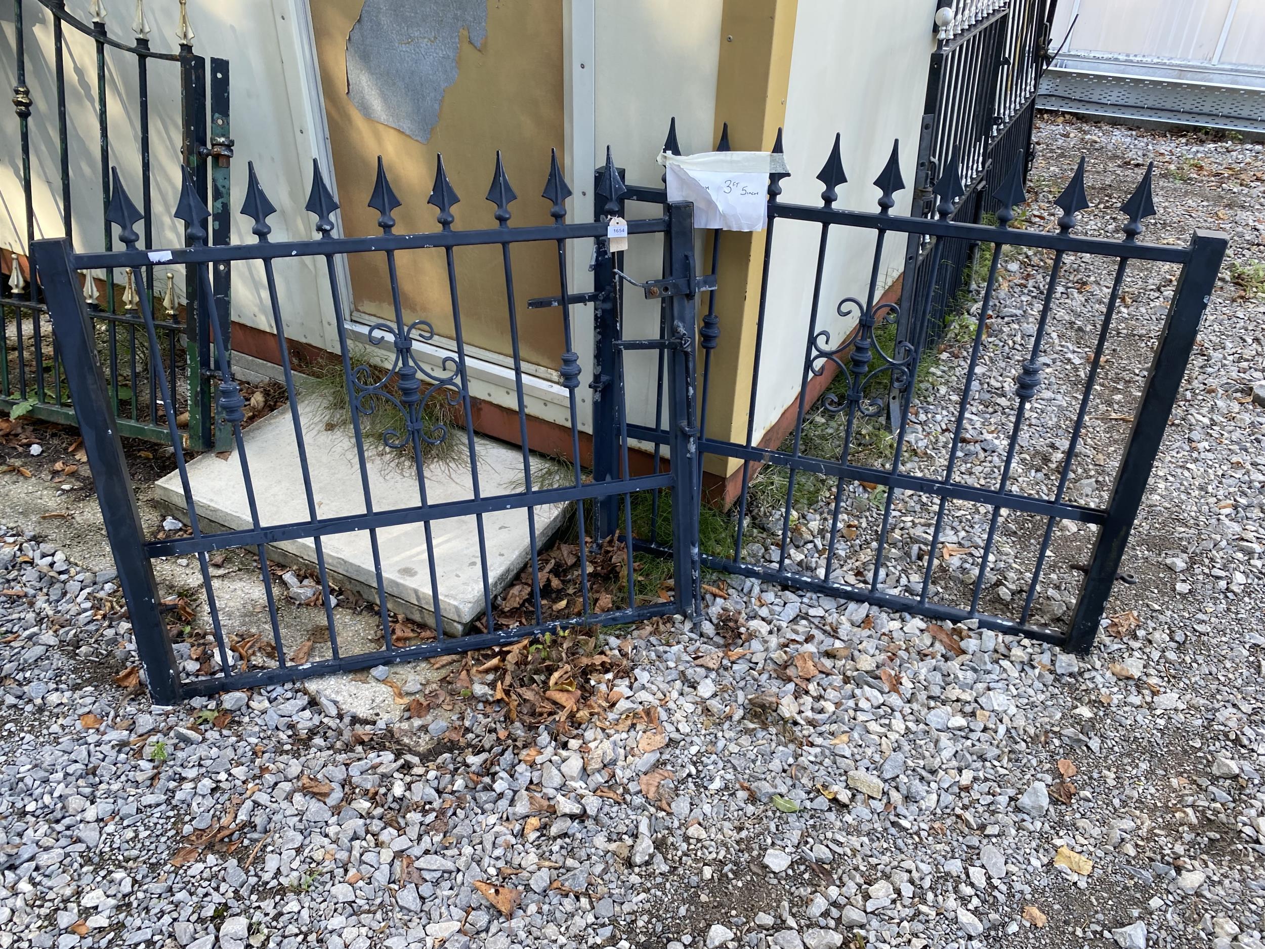 A PAIR OF WROUGHT IRON GARDEN GATES (W:7FT 6" H:3FT 5")