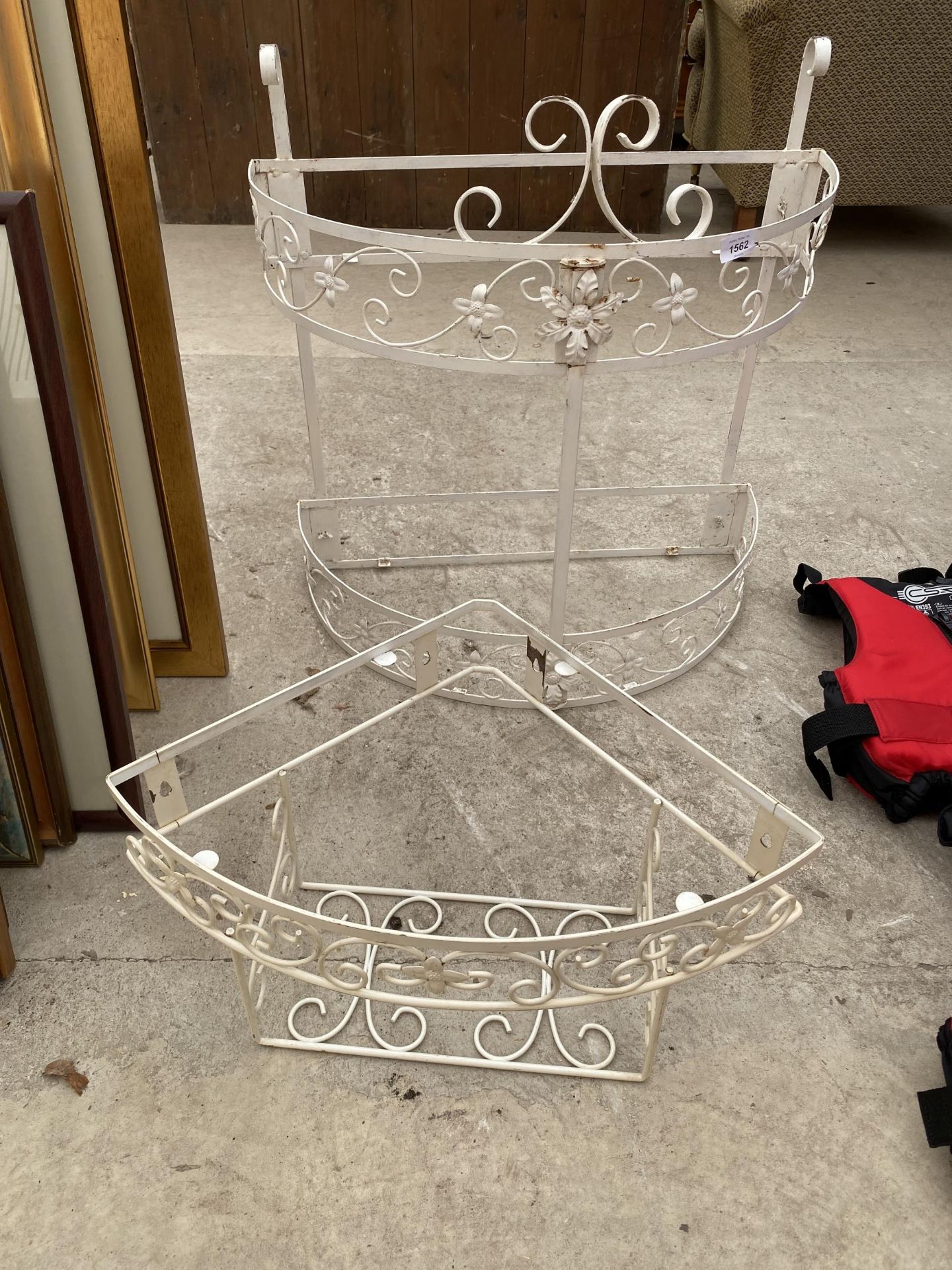 A METAL WHITE CORNER SHELF FRAME AND A ROUND TWO TIER UNIT