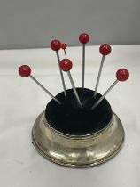 A HALLMARKED BIRMINGHAM SILVER PIN CUSHION WITH LARGE PINS