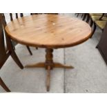 A MODERN PINE 36" DIAMETER DINING TABLE