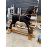 A MAMAS AND PAPAS PLUSH ROCKING HORSE ON WOODEN FRAME