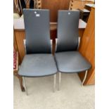 A PAIR OF CHROME FRAMED AND FAUX LEATHER DINING CHAIRS