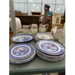 A LARGE QUANTITY OF BLUE AND WHITE CERAMIC PLATES, THREE JUGS AND A TREEN ELEPHANT STAND