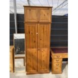A MODERN PINE TWO DOOR WARDROBE, 32" WIDE, WITH TOP BOX
