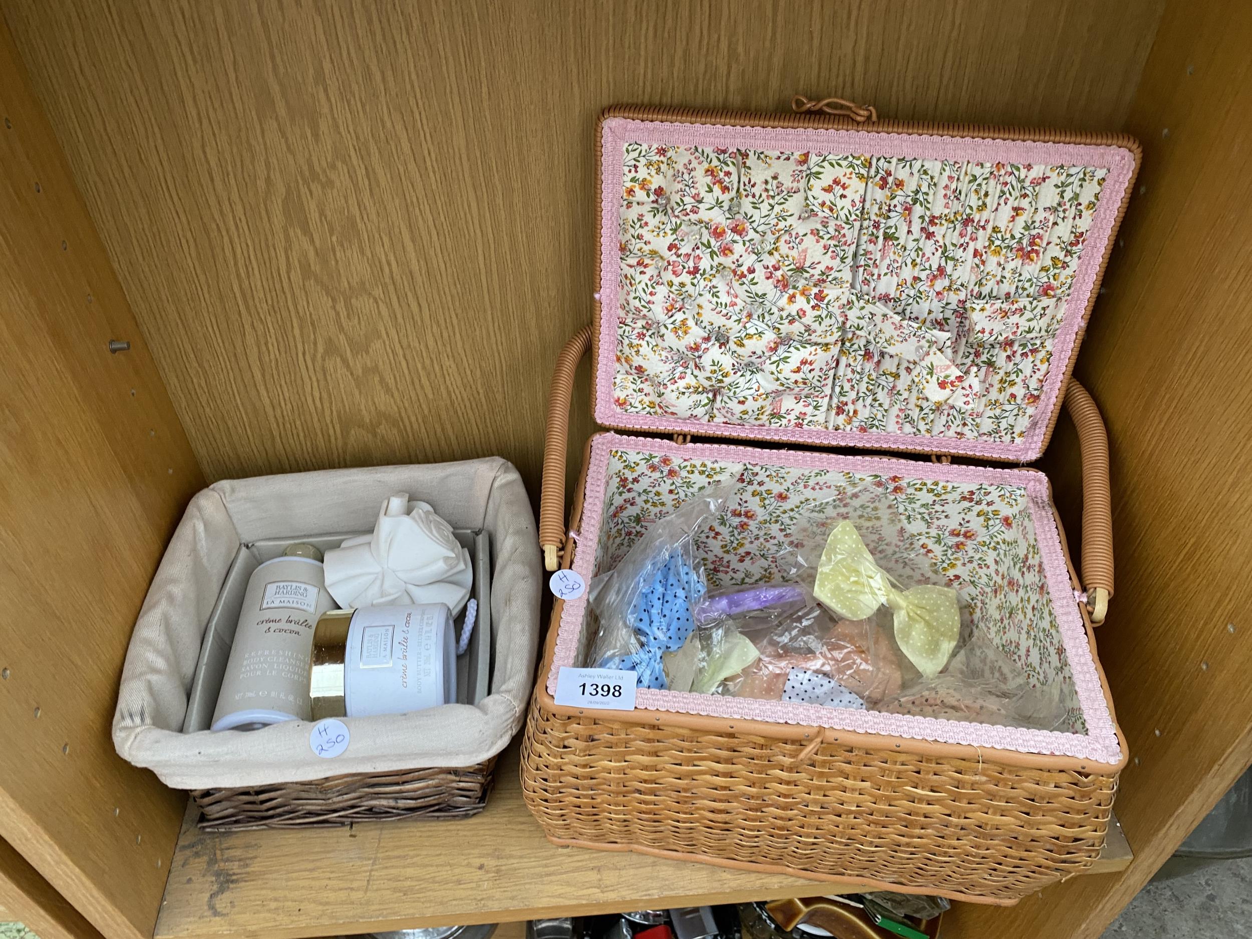 A WICKER BASKET CONTAING BAYLIS & HARDING TOILETRIES AND A FURTHER WICKER BASKET WITH CLIP ON BOWS