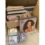 A LARGE ASSORTMENT OF LP RECORDS AND CDS