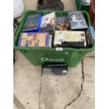 A LARGE ASSORTMENT OF VHS VIDEOS AND A RADIO
