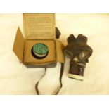 A BOXED WORLD WAR II GAS MASK AND A GAS MASK DATED 1940