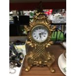A LARGE GILT COLOURED JULIANA MANTLE CLOCK WITH ELABORATE DECORATION HEIGHT 46CM