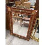 A MODERN REGENCY STYLE WALL MIRROR WITH APPLIED GILT METAL DECORATION AND TWO SMALL PORCELAIN