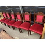 A SET OF SIX EDWARDIAN DINING CHAIRS ON TURNED AND FLUTED FRONT LEGS