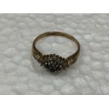 A 9 CARAT GOLD RING WITH A CLUSTER OF SAPPHIRE AND CUBIC ZIRCONIA SIZE O