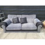 A MODERN GREY AND BLACK THREE SEATER SETTEE