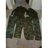 A LARGE COLLECTION OF MILITARY/SHOOTING/FISHING CABOUFLAGE UNIFORMS AND A KIT BAG