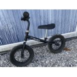 A STOMPEE CHILDS BALANCE BIKE