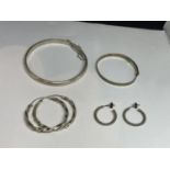 TWO MARKED SILVER BANGLES AND TWO PAIRS OF SILVER EARRINGS