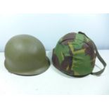 A USA PAINTED METAL HELMET AND LINER AND A CAMOUFLAGE COVERED HELMET