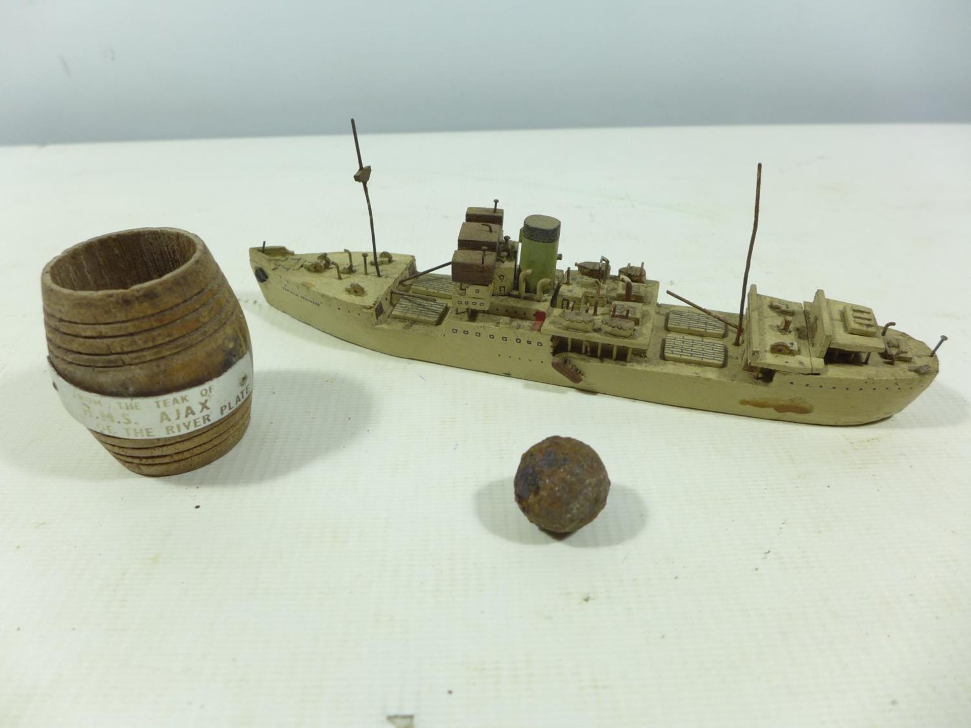 A MODEL OF THE SHIP 'JAMAICA PRODUCER' DATED 1946, LENGTH 21CM, TEAK BARREL FROM HMS AJAX, IRON BALL