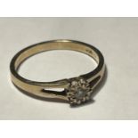 A 9 CARAT GOLD RING WITH A CENTRE DIAMOND SIZE N/O
