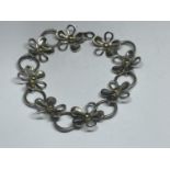 A SILVER AND GOLD DAISY BRACELET