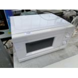 A WHITE MICROWAVE OVEN
