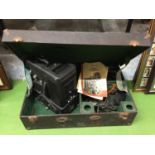 A VINTAGE DITMAR FILM PROJECTOR IN A CASE WITH INSTRUCTIONS AND ANCILLARIES