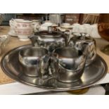 AN OLDE HALL STAINLESS STEEL TEASET TO INCLUDE A TRAY, TEAPOT, HOT WATER POT, CREAM JUG AND SUGAR