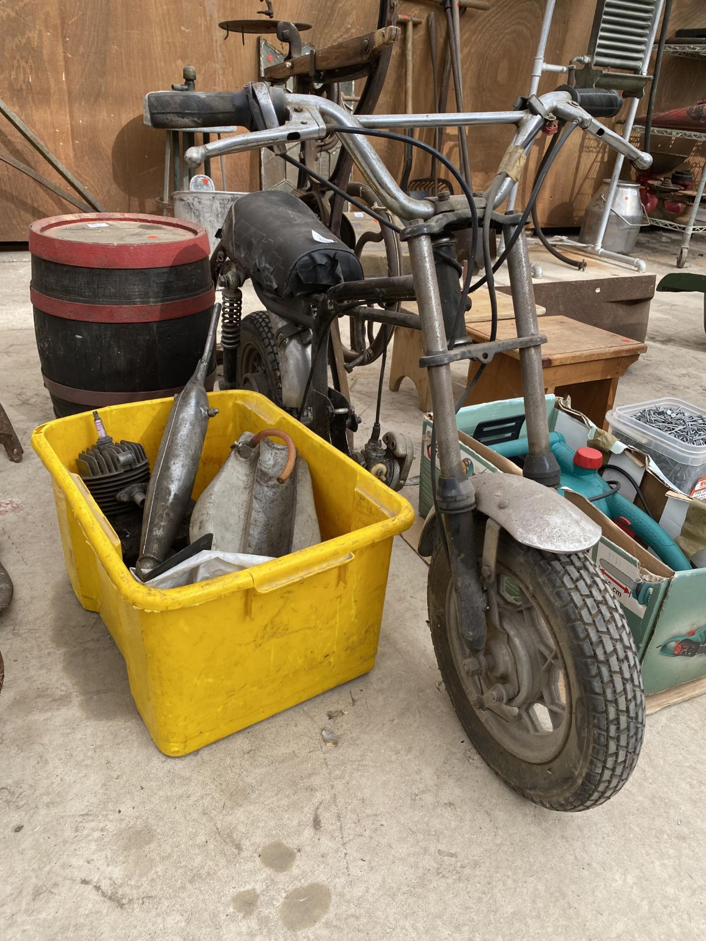 A SMALL MOTORBIKE AND SPARE PARTS FOR RESTORATION
