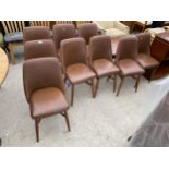 A SET OF NINE BEN CHAIRS WITH FAUX BROWN LEATHER SEATS, BACKS ON TURNED LEGS AND STRETCHERS