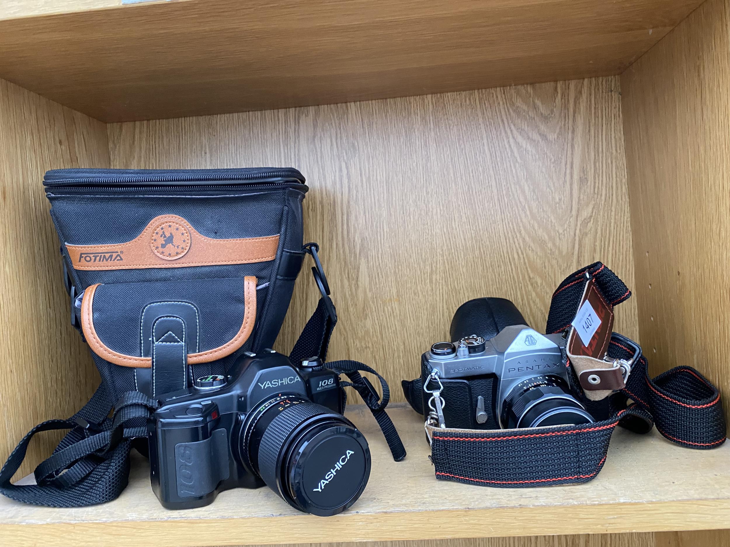 AN ASAHI PENTAX SPOTMATIC CAMERA AND A FURTHER YASHICA 108 MULTIPROGRAM CAMERA BOTH WITH CARRY CASES