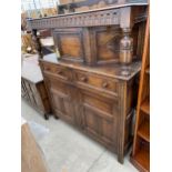 A JACOBEAN STYLE CARVED OAK COURT CUPBOARD 54" WIDE