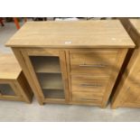 A MODERN OAK SIDE CABINET WITH GLASS DOOR AND THREE DRAWERS, 35.5" WIDE