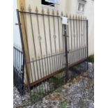 A PAIR OF TALL WROUGHT IRON GARDEN GATES (H:6FT 4" W:7FT 9")